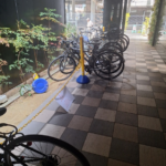 These images of informal bicycle parking in Japan show signs that say “Bicycle parking is forbidden here. In case of violations, we will alert the police.” Beside the sign, bicycles are parked in a tidy and regular fashion, with the chain taken down to allow more bikes to park. There is a formal rule, but a tacit understanding that it will not be respected, and a social rule requesting you to park your bike (illegally) in a tidy and proper manner. Source: Abel Polese. © Abel Polese.